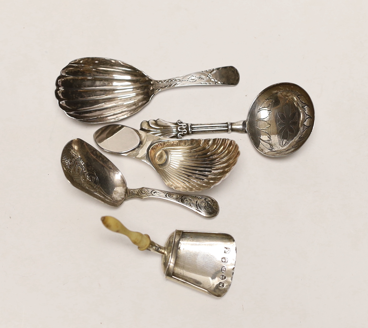 Five assorted 19th century silver caddy spoons, including bone handled shovel form, by John Bettridge, Birmingham, 1826, 68mm.